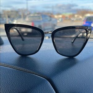 Black Cat-Eye Sunglasses with Metallic Frame and Dark Lenses